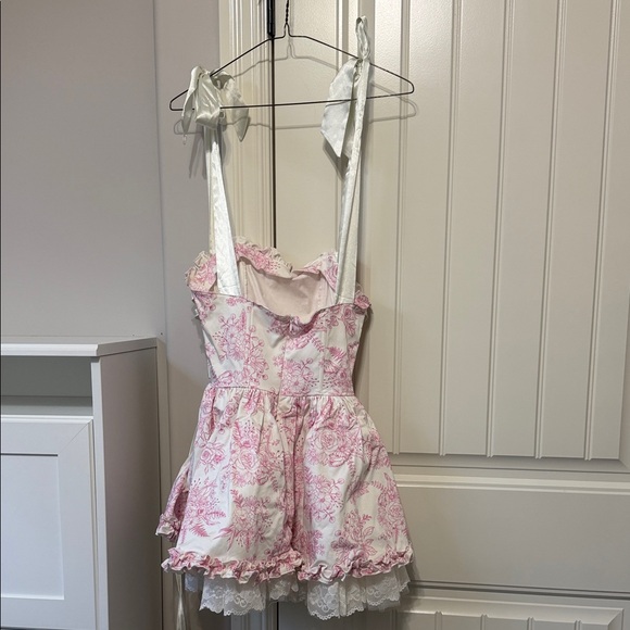 Dolls Kill White and Pink Floral Ruffled Mini Dress with Lace-Up Sides - Picture 2 of 2
